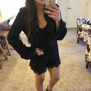 Bell sleeve black romper with crochet detail